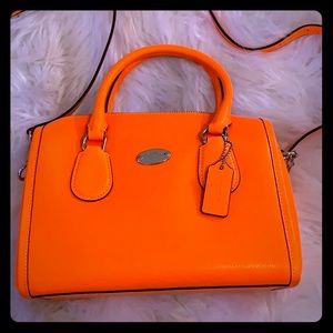 Vintage electric orange ‘Coach’ hand bag
